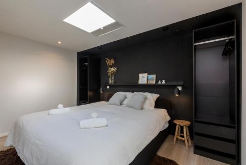 Postel nebo postele na pokoji v ubytování Piet Mondriaanstraat 6a, Domburg