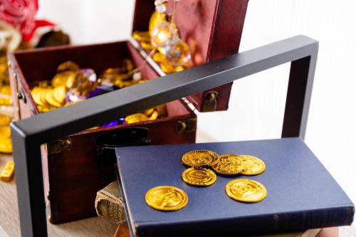 a black box with gold coins in it at Wave House Kujukuri Shimokaizuka Beachside - Self Check-In Only in Kujukuri