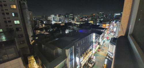 an overhead view of a city street at night at Friendly DH Naissance Hotel by Mindrum Group in Seoul