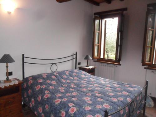 Ліжко або ліжка в номері Casale Santa Caterina