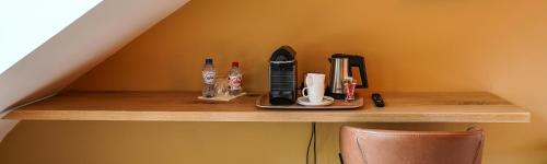 a wooden shelf with some office items on it at Les Terrasses des Falizes B&B in Rochefort
