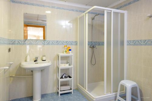 a bathroom with a shower and a sink at Casa Bonaire in Jávea