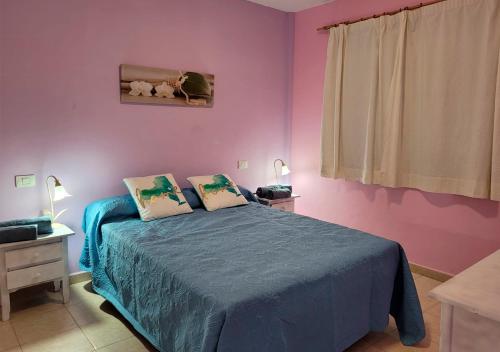 Postel nebo postele na pokoji v ubytování Apartamento funcional en residencial con piscina en inmejorable ubicación en centro de la isla