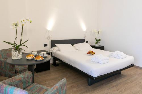 Ένα ή περισσότερα κρεβάτια σε δωμάτιο στο Hotel Molino Rosso