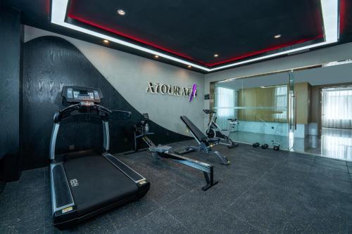 a gym with two exercise bikes in a room at Atour Hotel Lanzhou Xigu in Lanzhou