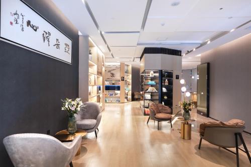 a salon with chairs and a waiting room at Atour Hotel Jining Lingxiu City Plaza in Jining