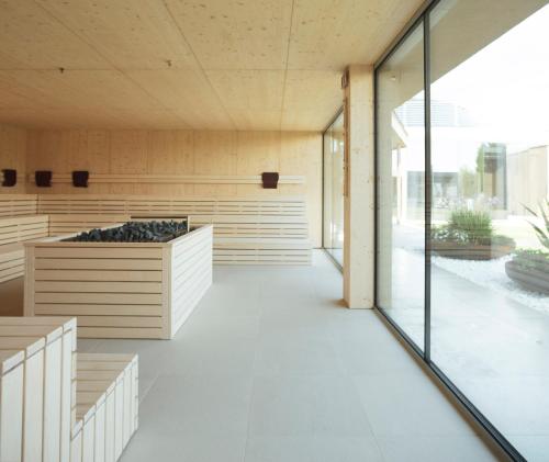 a room with sliding glass doors leading into a building at Mjus Resort & Thermal Park in Körmend