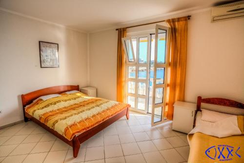 Ένα ή περισσότερα κρεβάτια σε δωμάτιο στο XXL Apartments