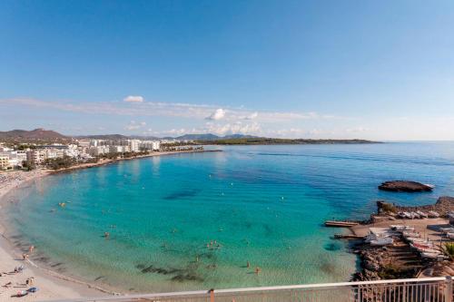 a view of a beach with people in the water at Mix Peymar in S'Illot