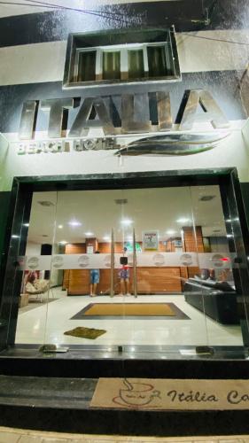 a display window of a furniture store with a room at Hotel Italia Beach - Na Beira Mar Natal RN in Natal