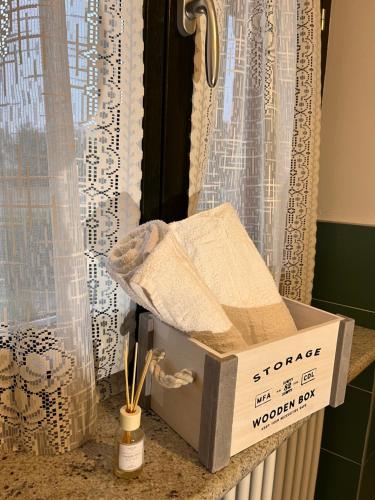 a box sitting on a counter next to a window at La Casa delle Favole in Fossano