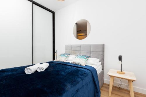 Кровать или кровати в номере Atrium Promenada Apartments Gocław by Renters