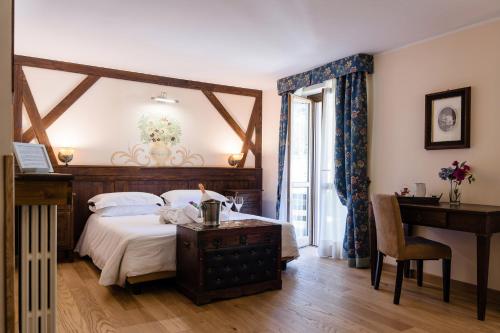 Postel nebo postele na pokoji v ubytování Chalet du Lys Hotel & SPA