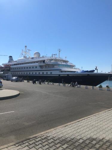 a large cruise ship is docked at a dock at булевард „Демокрация“ Апартамент Златна Рибка in Burgas