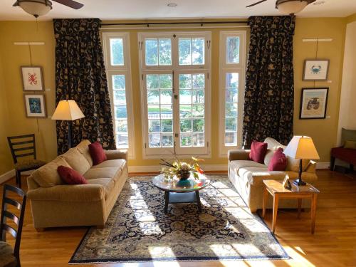 a living room with a couch and a table at City House Bed and Breakfast in Harrisburg