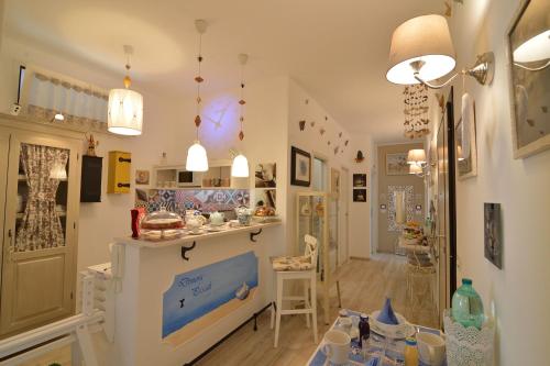 a living room with a counter and a room with a room at Dimora Pascali - "Home & Breakfast" in Polignano a Mare