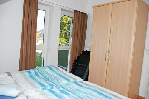 Una cama o camas en una habitación de Hoeft Residenz Alt Reddevitz