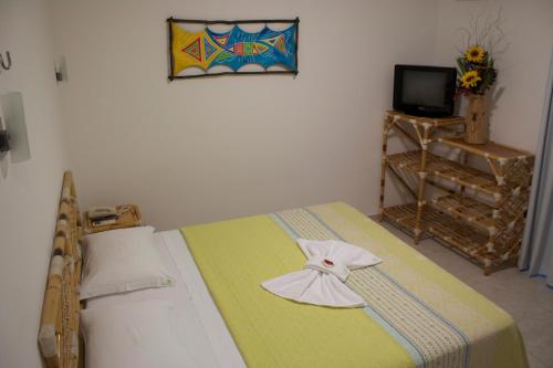 Una cama o camas en una habitación de Pousada Cocoa