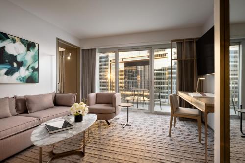 a living room with a couch and a table at Fairmont Century Plaza Los Angeles at Beverly Hills in Los Angeles