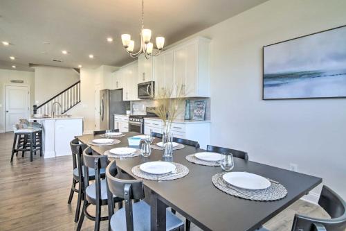 a dining room and kitchen with a table and chairs at Beach Shuttle and Pool Bishops Landing Townhome in Millville
