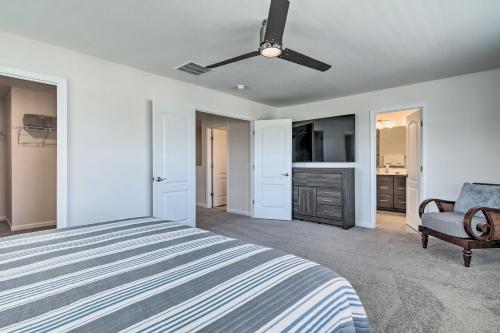 a bedroom with a bed and a ceiling fan at Beach Shuttle and Pool Bishops Landing Townhome in Millville