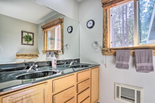 a bathroom with a sink and a window at Spacious Black Hawk Home with Furnished Deck! in Blackhawk