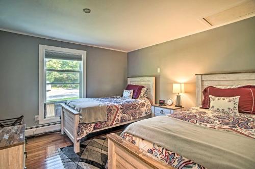 a bedroom with two beds and a window at Family-Friendly Tisbury Escape - Walk to Town in Vineyard Haven