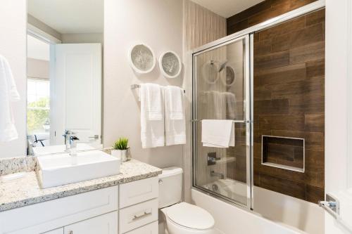 a bathroom with a sink toilet and a shower at 5min Disney Wonderful Villa, BBQ, SMV102 in Orlando