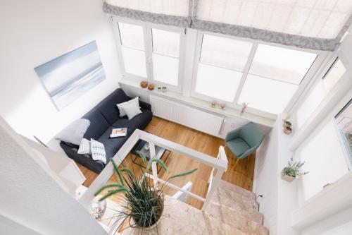 an overhead view of a living room with a blue couch at Fewo Grete in Norderney