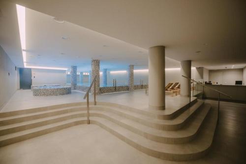 a staircase in a building with a view of the ocean at Apartman Pegasus in Vrnjačka Banja