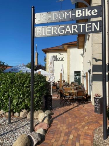 a sign that reads use don bikerigerator outside a restaurant at Usedom Bike Hotel & Suites in Ostseebad Karlshagen