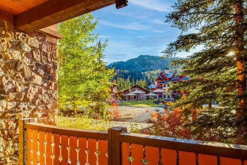 a view from the porch of a house with a fence at Eagle Springs East 101: Red-wing Suite in Solitude