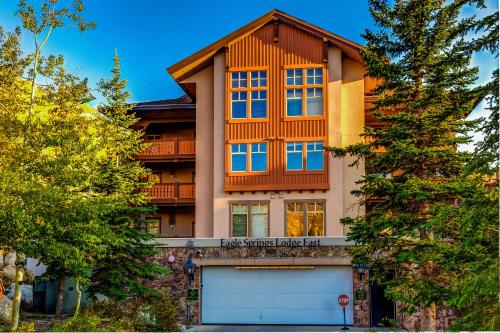 a house with a garage in front of it at Eagle Springs East 101: Red-wing Suite in Solitude
