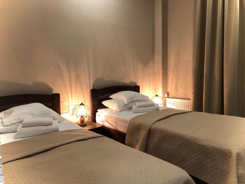 Säng eller sängar i ett rum på Atlant Hotel