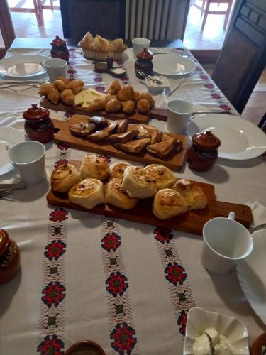 a table topped with different types of pastries and desserts at Domaćinstvo Bakić in Irig