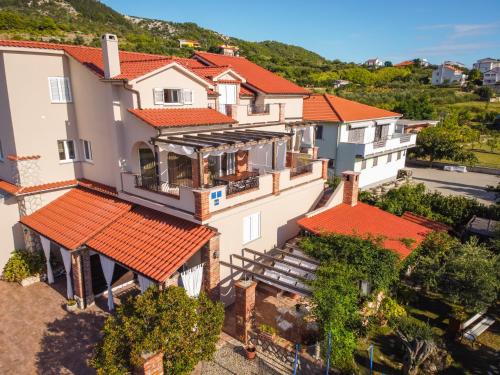 an aerial view of a house with red roofs at Apartments Vintage in Rab