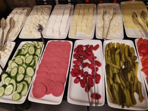 a table with trays of different types of vegetables at taksim diamond hotel in Istanbul