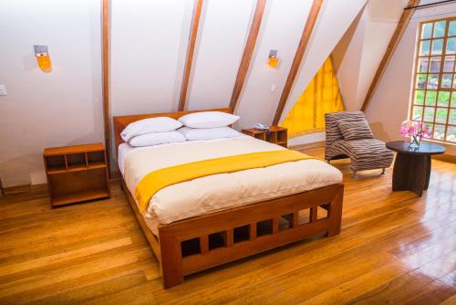 Ένα ή περισσότερα κρεβάτια σε δωμάτιο στο Amaru Valle Hotel