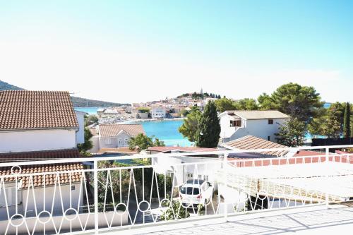 a view of the water from the balcony of a house at Rooms Bozena in Primošten
