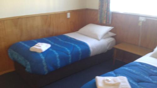 Posteľ alebo postele v izbe v ubytovaní Otaki Motel