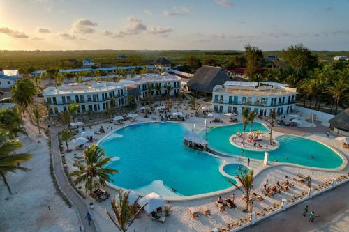 an overhead view of a pool at a resort at The One Resort Zanzibar in Makunduchi