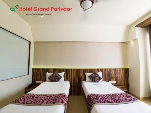Katil atau katil-katil dalam bilik di Hotel Grand Parivaar