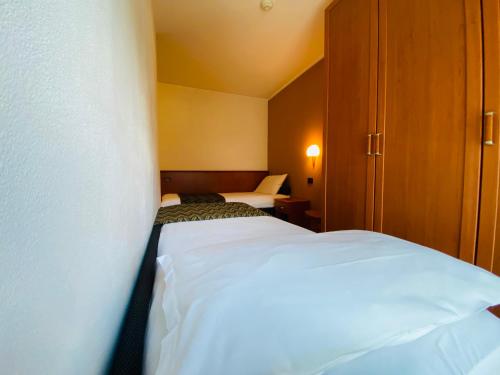 Ein Bett oder Betten in einem Zimmer der Unterkunft Residence Pizzo Scalino