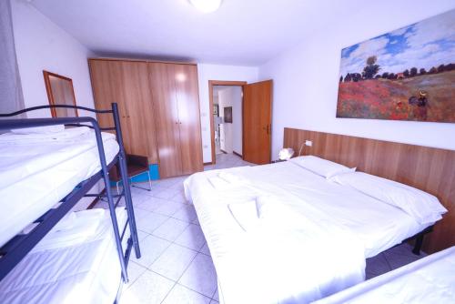 a bedroom with two bunk beds in a room at 1Dest - Best Location in Riva del Garda