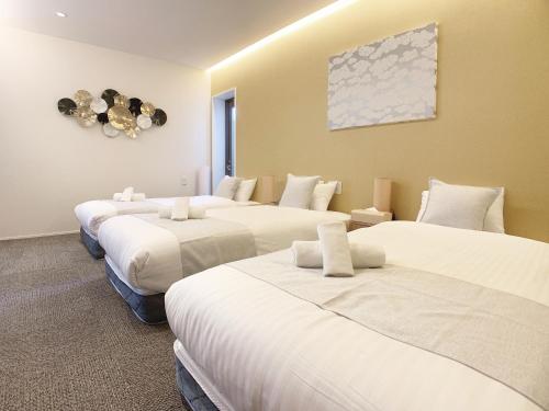 Ein Bett oder Betten in einem Zimmer der Unterkunft HOTEL CLA-SS HIROSHIMA-TOKAICHI
