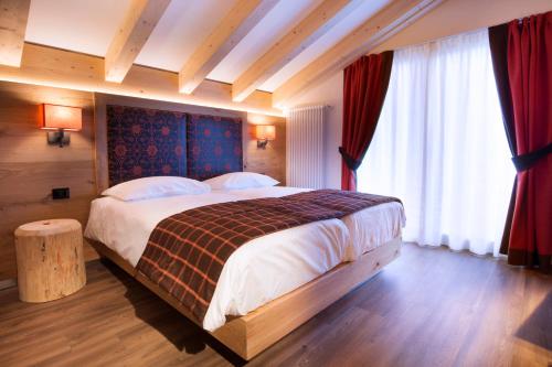 Voodi või voodid majutusasutuse Chalet Marcora toas