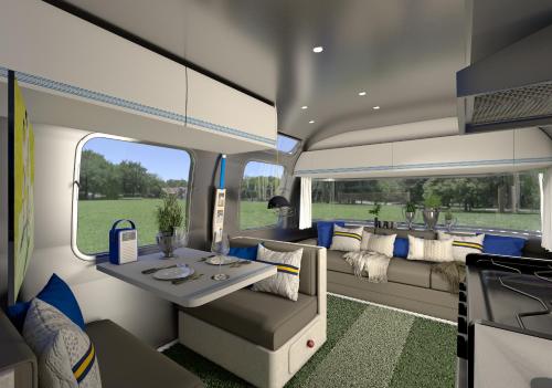 an inside view of a rv with a table and couch at The T20 Pavilion – An Ultimate Cricket Stay UK in Totteridge