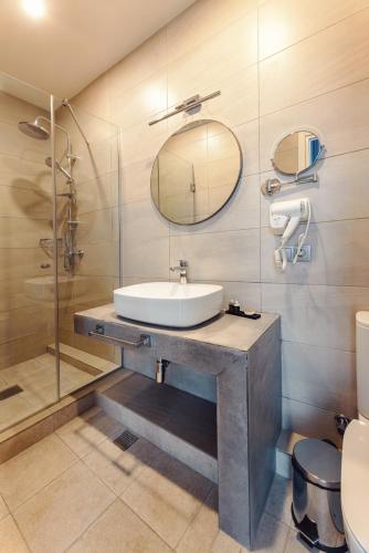 a bathroom with a sink and a shower at Meta Business Hotel By King David in Tbilisi City