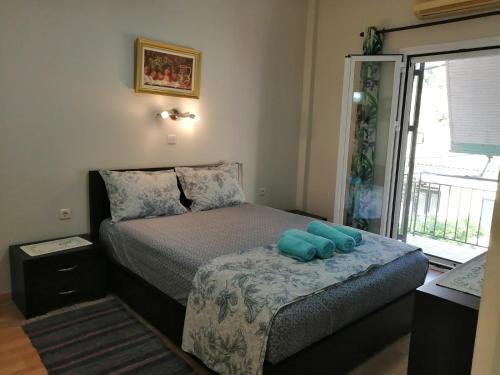 A bed or beds in a room at Flora's Boutique Apartment at the heart of Corfu