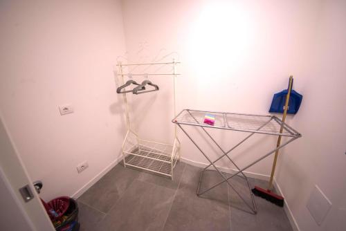 a room with a glass shelf and a hanger at 1Dest - Best Location in Riva del Garda